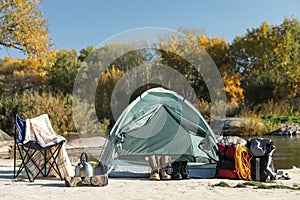 Set of equipment near camping tent
