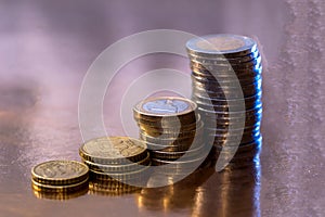 set of euro coins allocated on a golden background