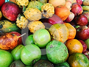 Set of exotic and colorful tropical fruits: including apple, orange, mango photo