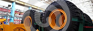 Set of extremely big wheels standing at warehouse