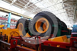 Set of extremely big wheels standing at warehouse