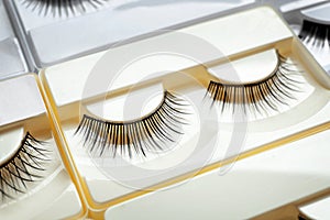 Set with false eyelashes in pack as background