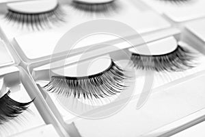 Set with false eyelashes in pack as background