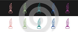 Set Feather and inkwell icon isolated on black and white background. Vector