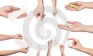 Set of  female  hands  holding care objects  -  pads and tampon sisolated on white background - Image