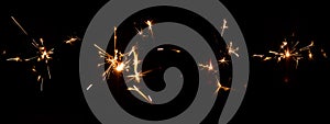 Set of festive sparkler with sparks on black background for overlay blending mode for holiday design projects