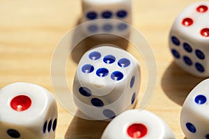 Set of a few simple game dice, central one showing number six. Chances in gaming, board games, leisure, gambling, random numbers