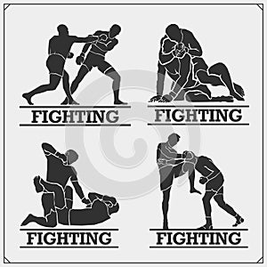 Set of fighting club emblems, labels, badges and icons. Fighters silhouettes. photo
