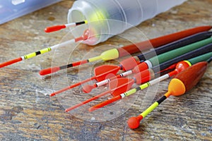 Set of fishing bobbers on a wooden table