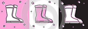 Set Fishing boots icon isolated on pink and white, black background. Waterproof rubber boot. Gumboots for rainy weather