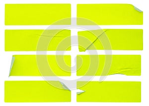 A set of fluorescent neon yellow rectangular paper sticker label isolated on white background