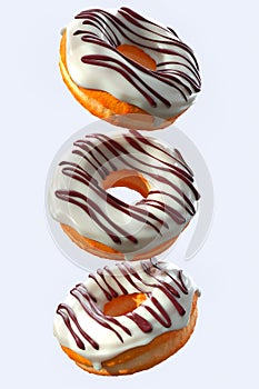 Set of flying glazed donuts with sprinkles on a white background