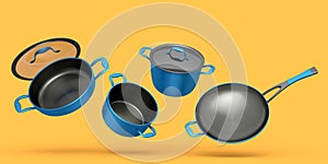 Set of flying stewpot, frying pan and chrome cookware on yellow background