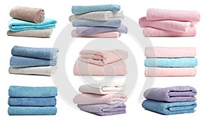 Set of folded colorful towels on white background