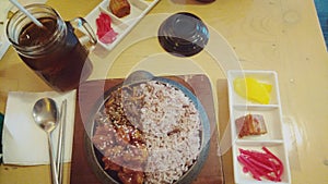 A set of food, bulgogi chicken rice complete with its accompaniment