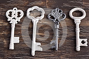 Set of four antique keys, one being different