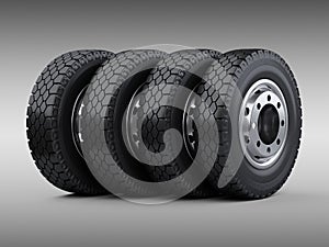 Set of four big vehicle truck tires stacked. New car wheels with