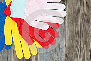 Set of four colored construction gloves