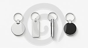 Four different metal keychains with blank circular and rectangular tags on a white background
