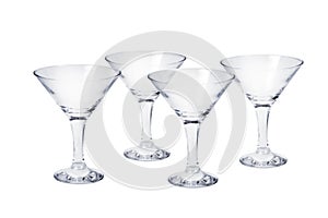 Set of four empty cocktail glasses photo