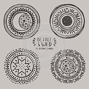 Set of four ethnic style symbols, moon, sun and stars