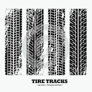 set of four grungy wheel tire tracks