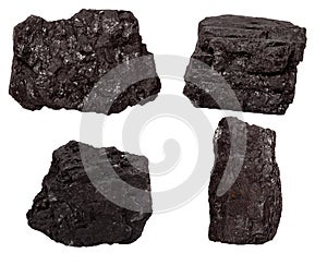 Set of four piece of coal isolated on a white