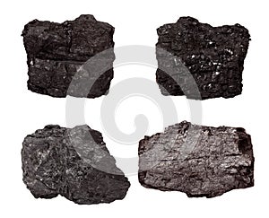 Set of four piece of coal isolated on a white