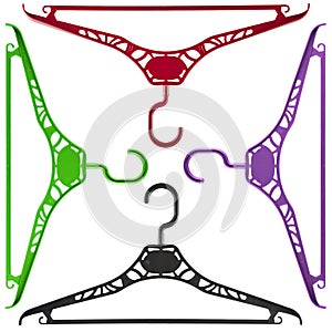 Set of four plastic hangers of different bright colors isolated on a white background.