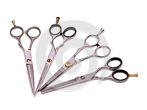 A set of four professional hairdressing scissors