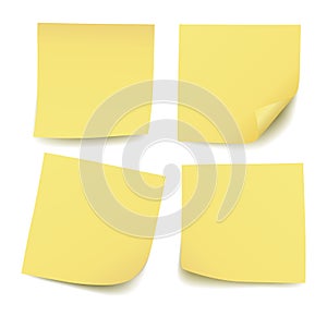 Set of four realistic blank vector yellow post it notes isolated on white background