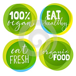 Set of four vegetarian labels with lettering. Healthy food stickers.