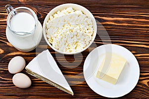 Set of fresh dairy products on wooden background.