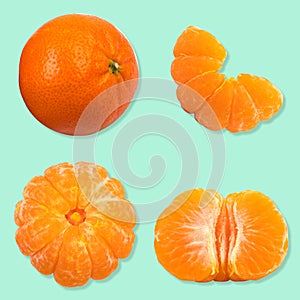 Set of fresh whole and cut mandarin, tangerine and slices isolated on green background. From top view