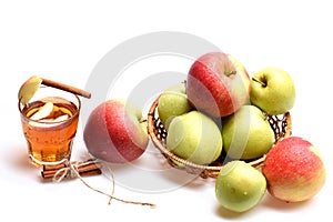 Set of fruit placed in wicker bowl near hot tea