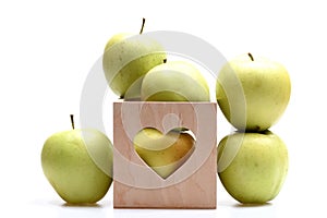 Set of fruit placed in wooden valentines box with heart