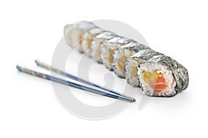 Set of futomaki sushi and chopsticks isolated on white background