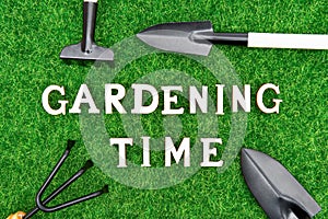Set of gardening hand tools on grass