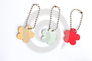 Set of genuine leather flower tags on white background