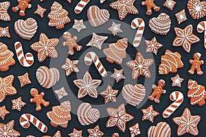 Set of gingerbread on dark wooden background. Christmas cookies. Flat lay