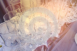 A set of glass of wedding setting with cutlery . Table set for an event party or wedding reception.