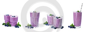 Set with glasses of blueberry smoothie, fresh berries and mint on white background. Banner design