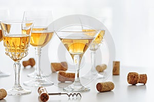 Set of glasses of yellow wine at wine tasting