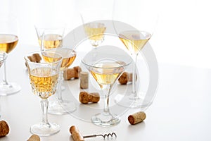 Set of glasses of yellow wine at wine tasting