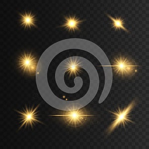 Set Glowing golden lights and stars. Isolated on transparent background. Vector illustration,