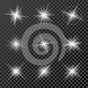 Set of glowing lights, stars and sparkles on black transparent background