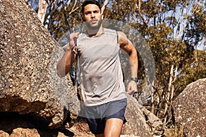 Set goalposts while you run. a handsome young man running alone outdoors.