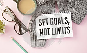 Set goals, not limits. Decision making - handwriting on a notebook with