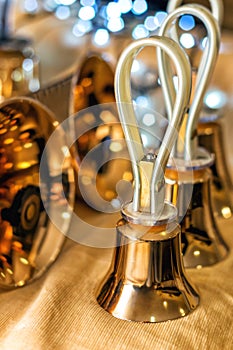 Set of gold handbells on table during concert