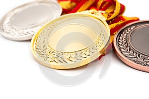 Set of gold silver and bronze award medals on white